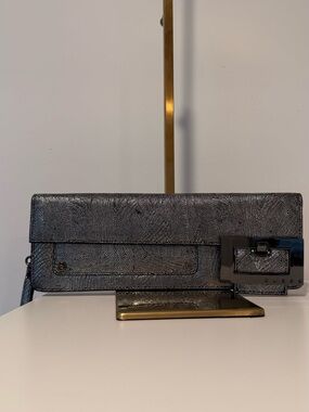Guess Metallic Silver Textured Clutch with Buckle